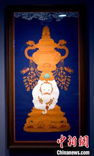圖為5月16日，展覽中的新創(chuàng)唐卡作品《瑞象承香》?！±盍?攝